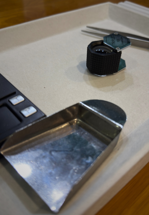 Gemstones and viewing tools prepared for a private appointment
